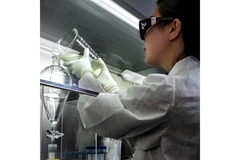 Image Scientist conducting chemical analysis in laboratory